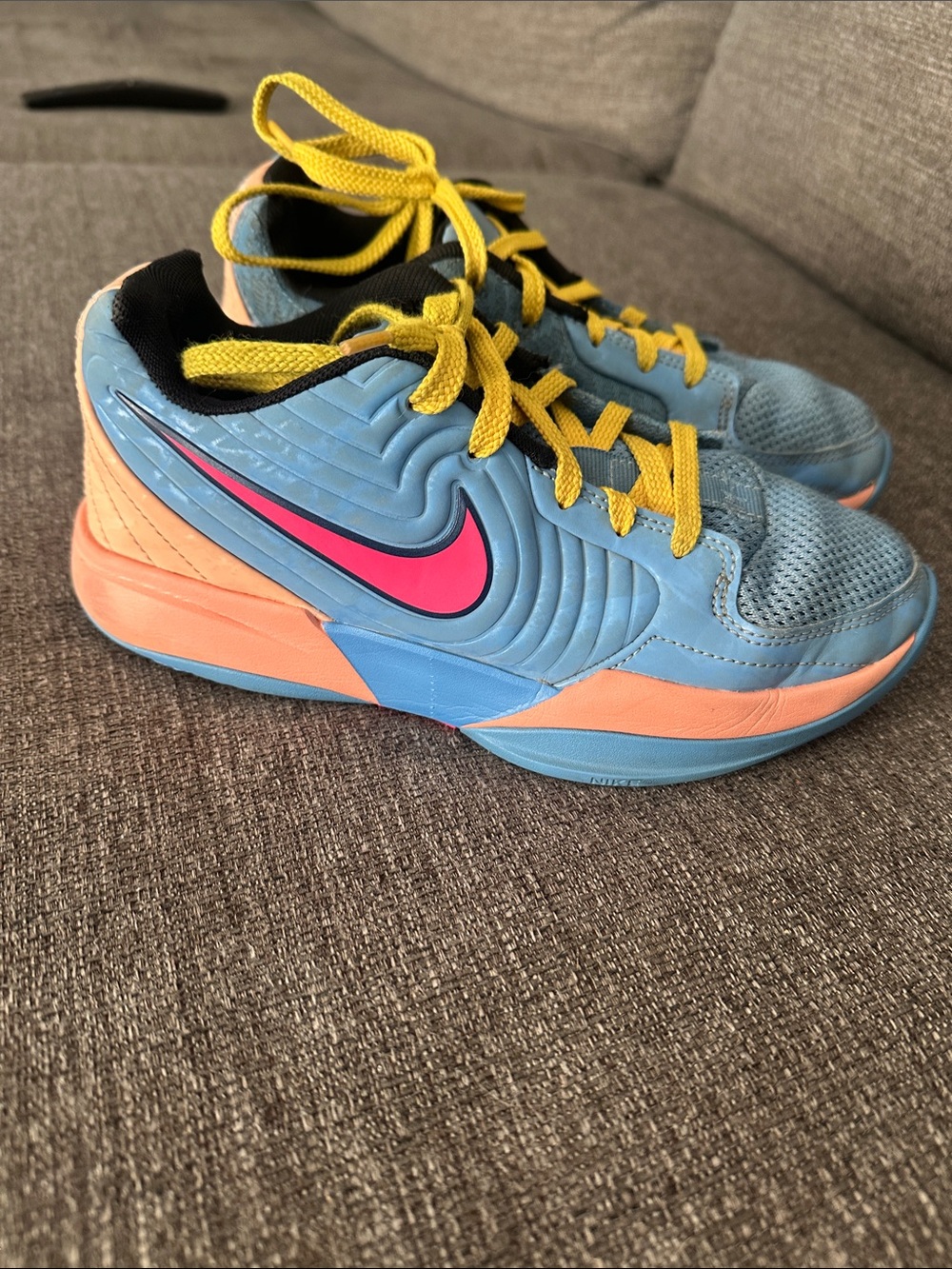 Nike Kids Light Blue Sneakers with Pink Swoosh and Yellow Laces